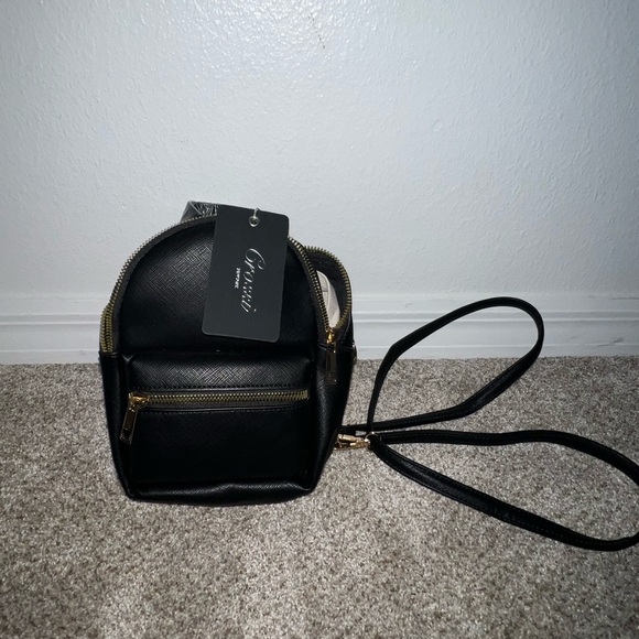 Crossi Handbags - Brand New Elegant Black Mini Backpack with gold accents